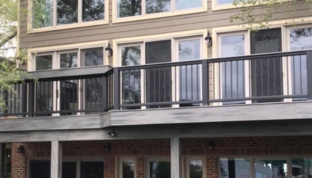 Gravel Path decking with Island Mist border, fascia and wrapped beams and footings. Transcend black rail with Island Mist cocktail top, bar and privacy wall. West Bloomfield, Michigan