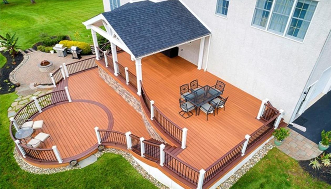 Trex Transcend Tiki Torch Deck with Lava Rock boarder, Vintage Lantern Railing with Custom Roof.