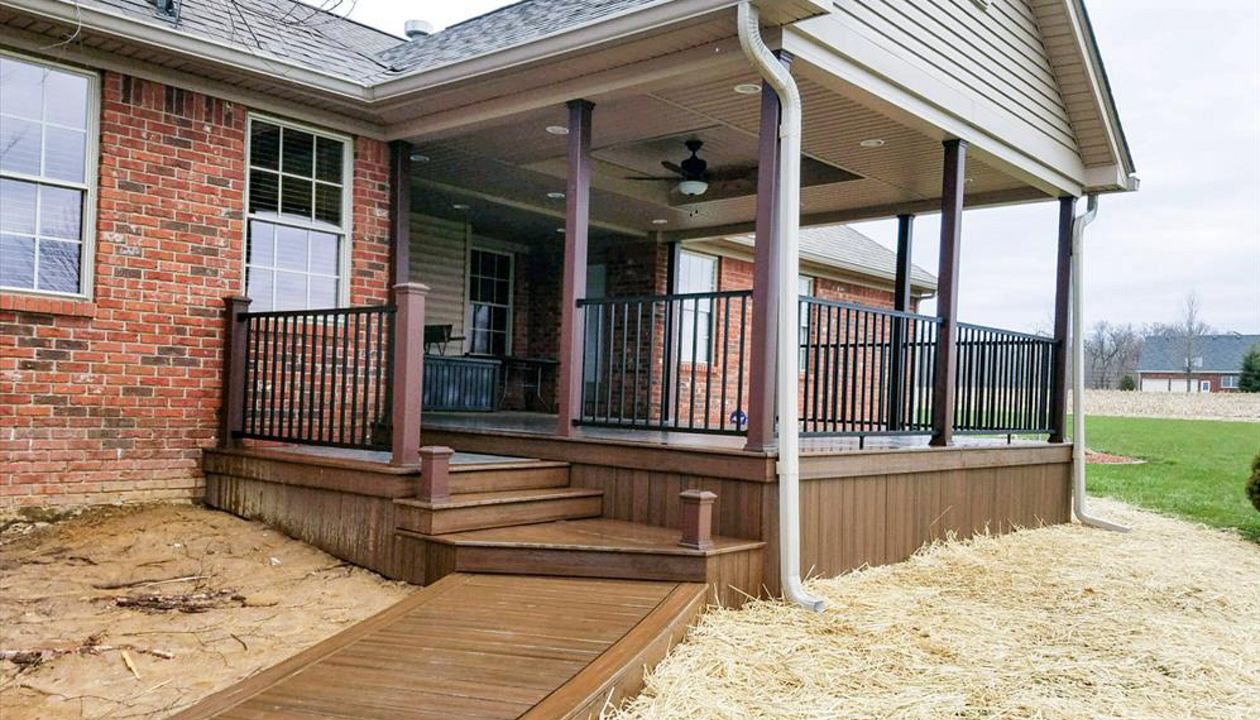 Trex Transcend Island Mist w/ Spiced Rum border and steps. Trex Signature Aluminum black railing w/ Vintage Lantern post sleeves