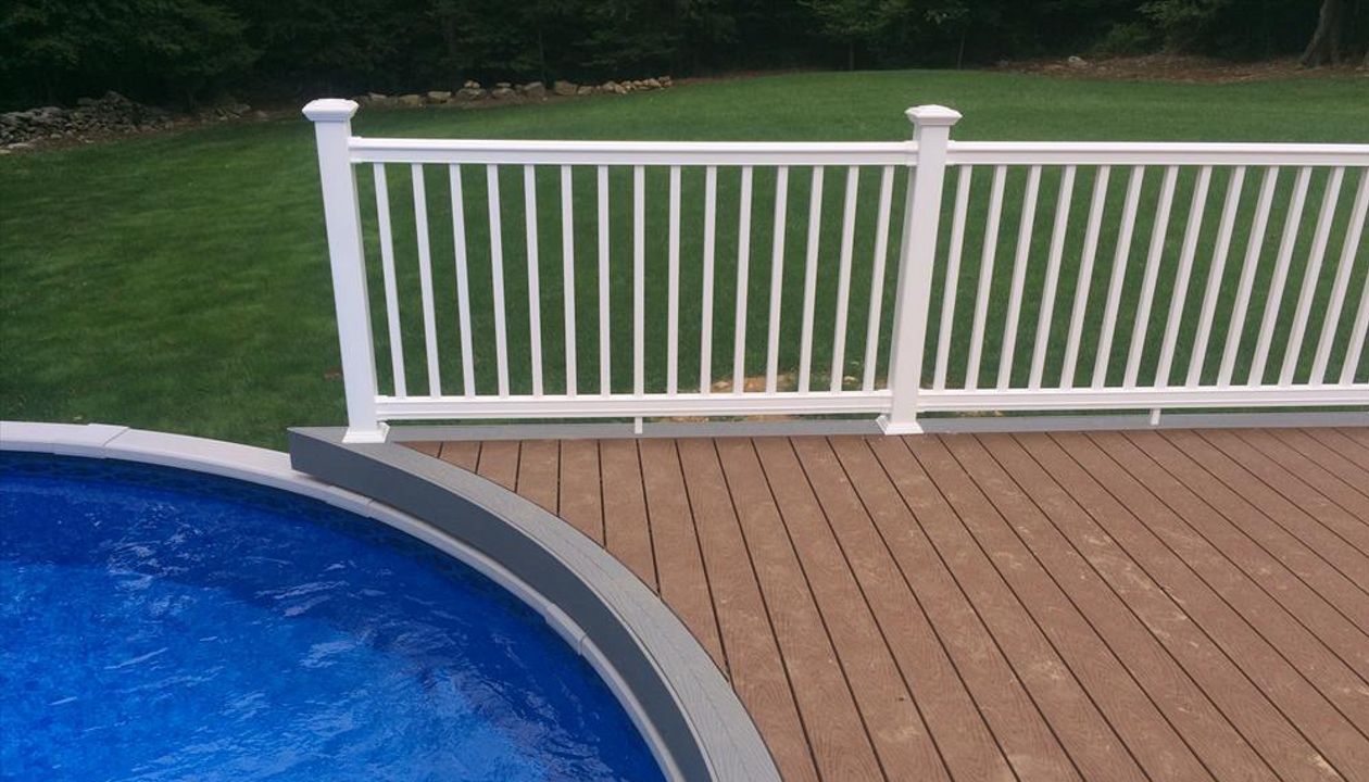 select saddle decking with pebble grey border, fascia and risers. vinyl rail