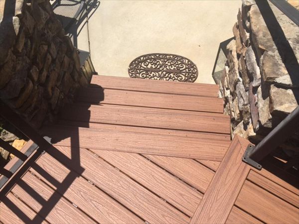 A small Trex landing and stairs are your final path to a the pool area