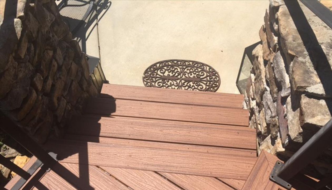 A small Trex landing and stairs are your final path to a the pool area