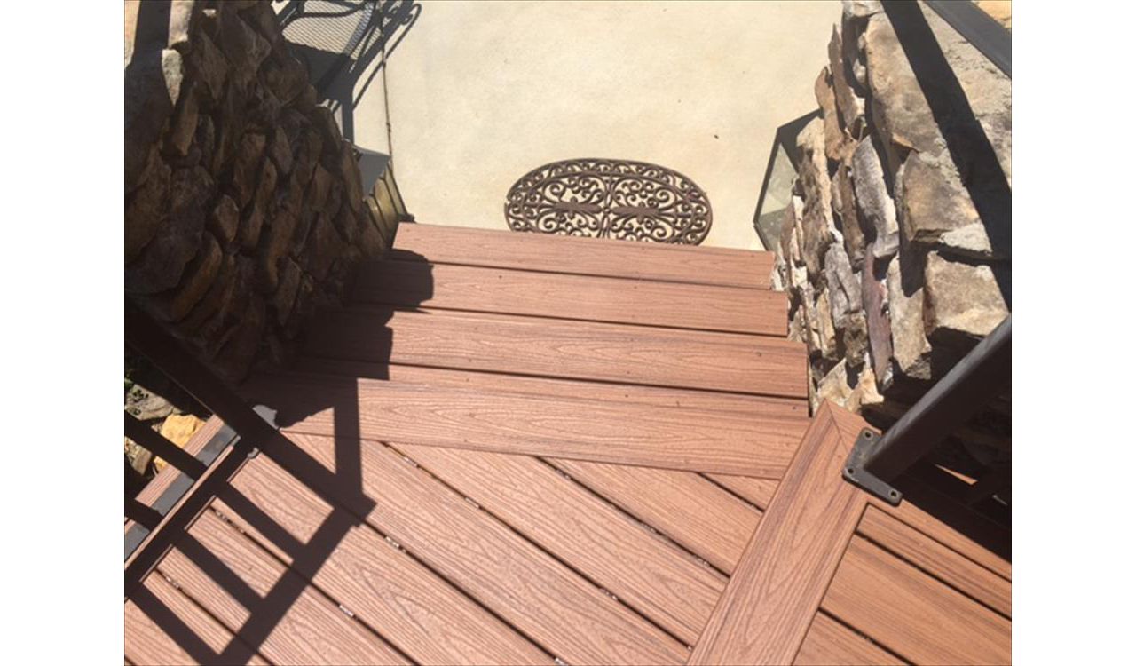A small Trex landing and stairs are your final path to a the pool area