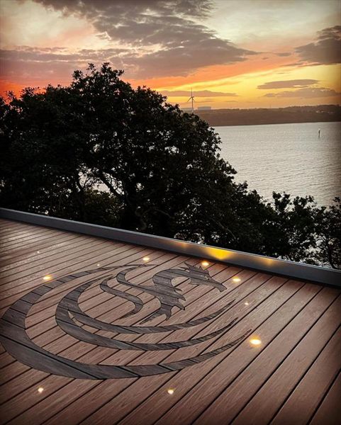 Trex Transcend Tiki Torch field with Lava Rock boarder and Welsh Dragon inlay . Built at Pembroke Dock