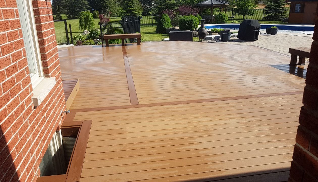 Main: Trex Enhance Basics in Beach Dune. Trim: Trex Enhance Basics in Saddle. Contact Align Decking today for your custom composite decking needs. Servicing Durham Region, Kawartha Lakes, and the Barrie & Orillia areas.