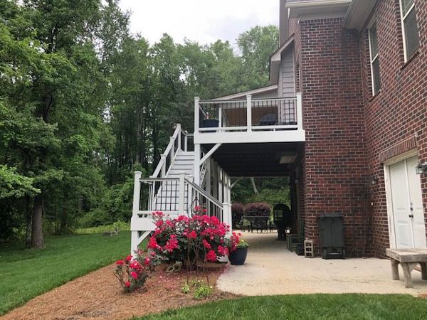 Great set of Trex Select Pebble Grey stairs with Select Classic White railing welcomes you on this great space