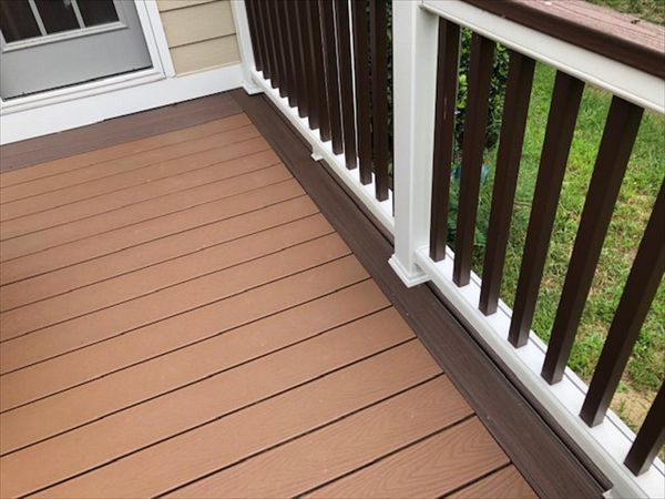 Trex Transcend White Railing is a great contrast to the dark Trex Transcend Lava Rock picture frame decking material.