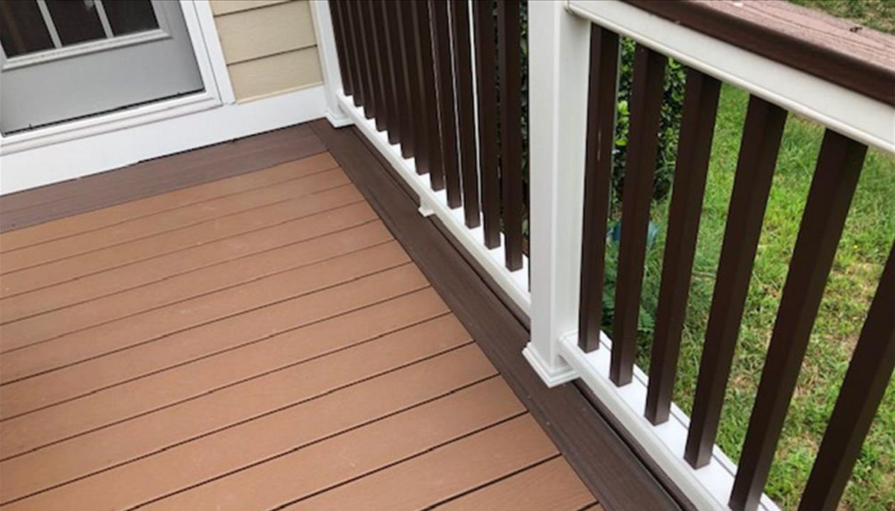 Trex Transcend White Railing is a great contrast to the dark Trex Transcend Lava Rock picture frame decking material.