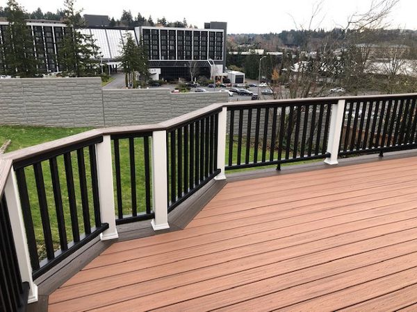 Trex Transcend Tiki Torch body w/ Spice rum boarder. Transcend railing w/ cocktail top cap and rain escape