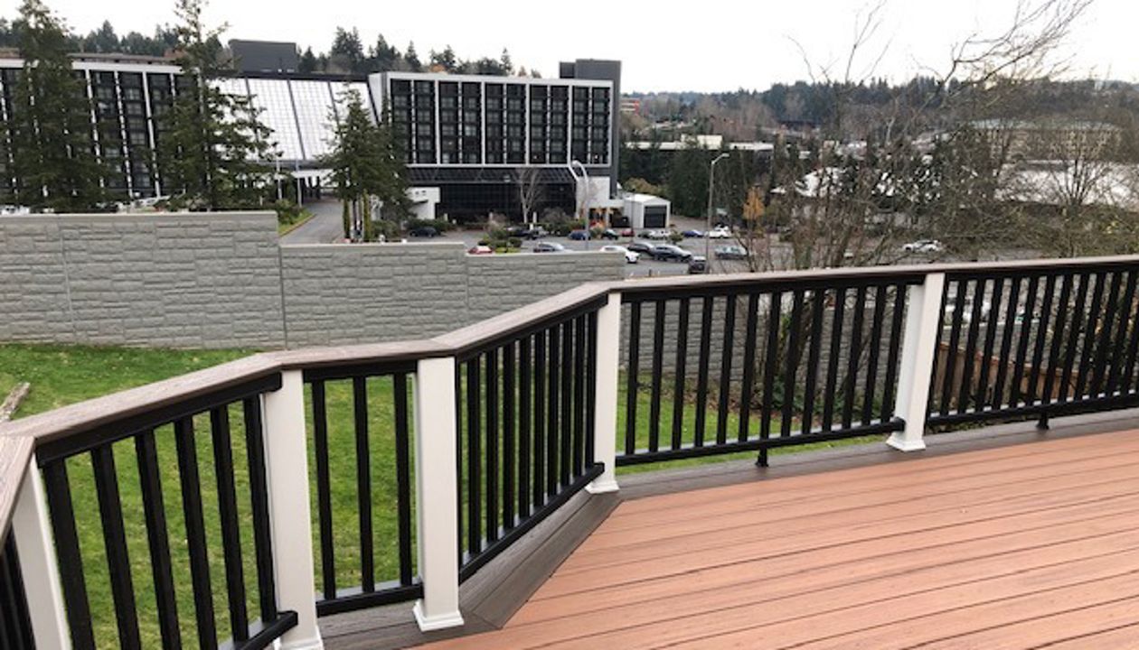 Trex Transcend Tiki Torch body w/ Spice rum boarder. Transcend railing w/ cocktail top cap and rain escape