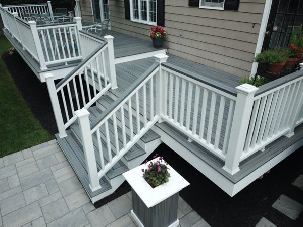 Amazing 2-Tier 500 Square Foot Outdoor Living Deck Space, Trex Transcend Island Mist Decking with Trex Transcend White Composite Railings and Island Mist Cocktail Rails, in Peabody, MA
