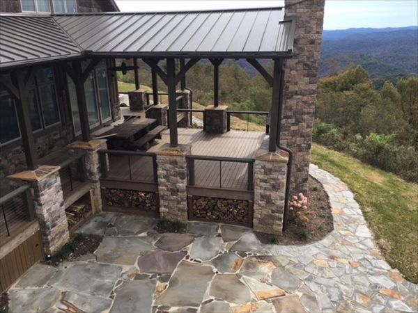 Great view from above of Trex Transcend Havana Gold deck with entertaining area & fireplace is perfect for entertaining!