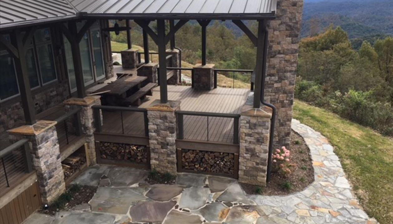 Great view from above of Trex Transcend Havana Gold deck with entertaining area & fireplace is perfect for entertaining!