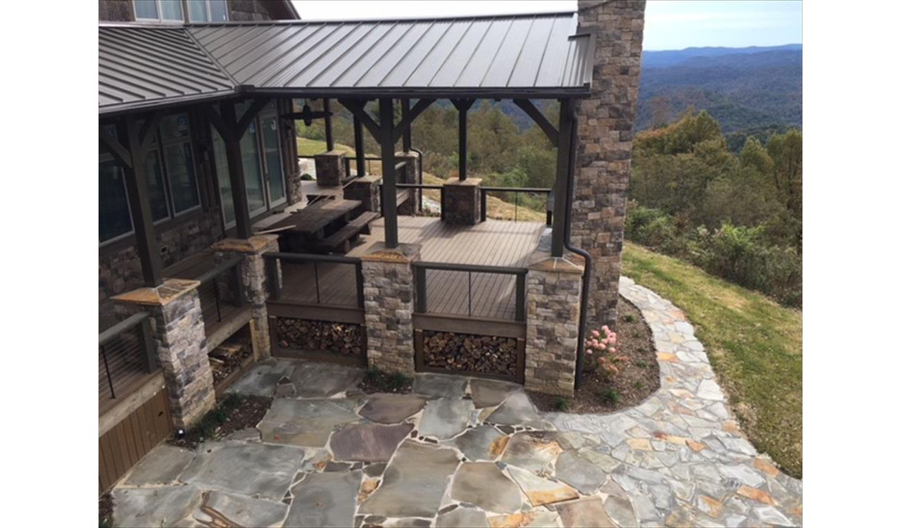 Great view from above of Trex Transcend Havana Gold deck with entertaining area & fireplace is perfect for entertaining!