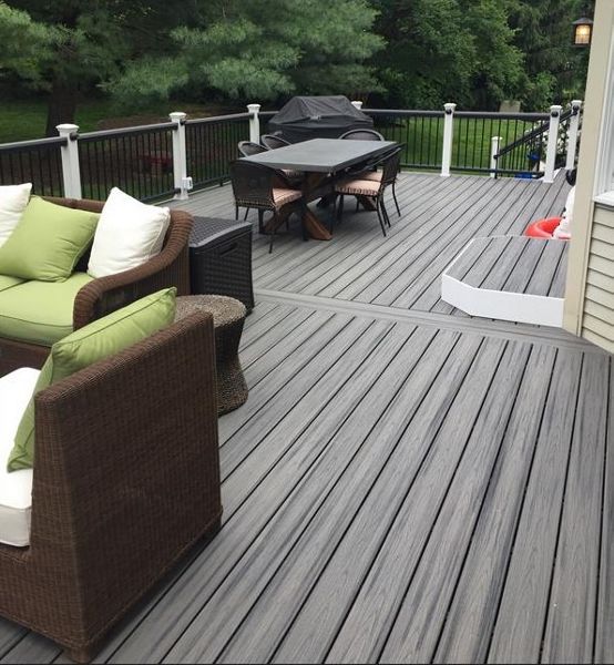Trex Transcend Island Mist Deck with Trex Transcend Vintage Lantern Railing is great outdoor living space