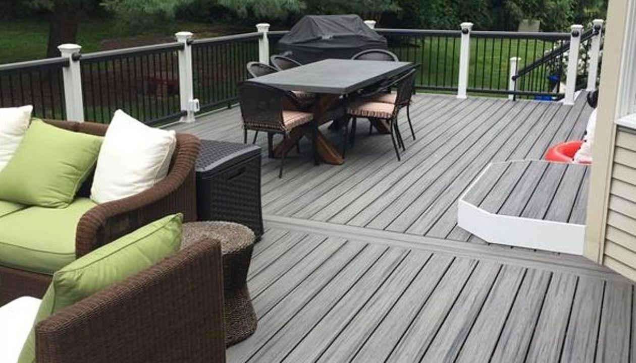 Trex Transcend Island Mist Deck with Trex Transcend Vintage Lantern Railing is great outdoor living space