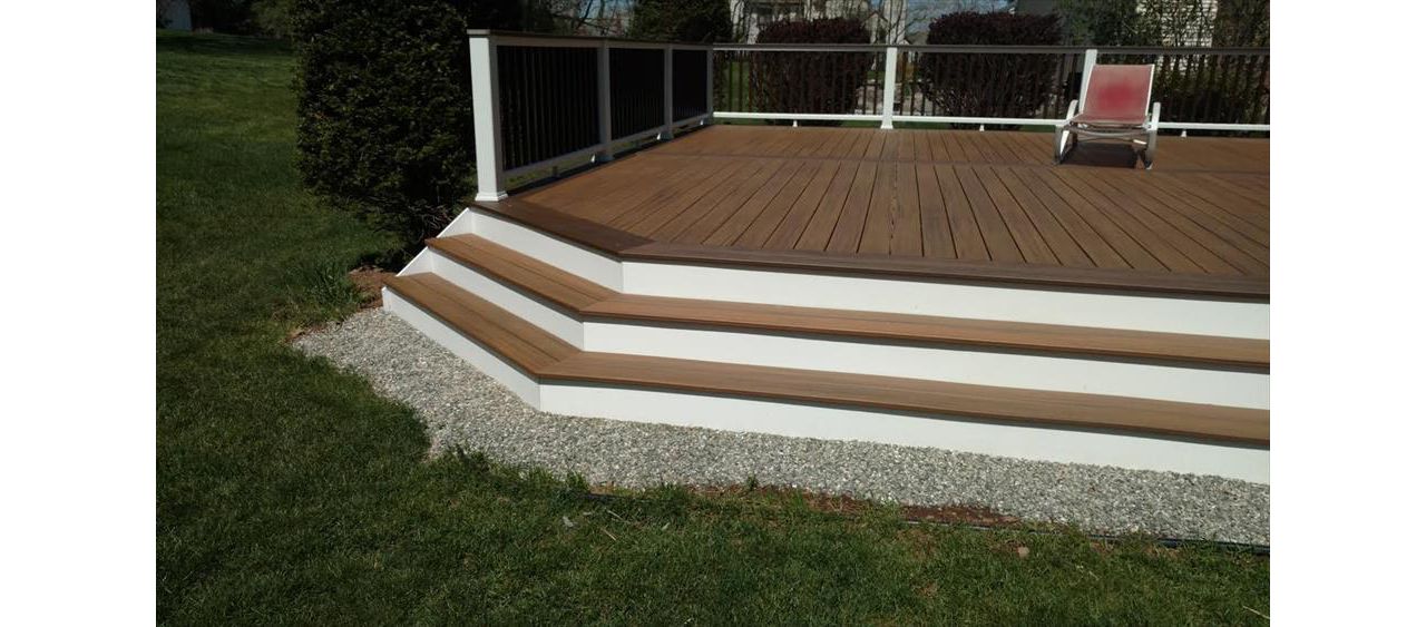 Custom Step Pads built with Trex Havana Gold with a Trex Spiced Rum boarder. Trex railings were used on the Derby CT Deck.