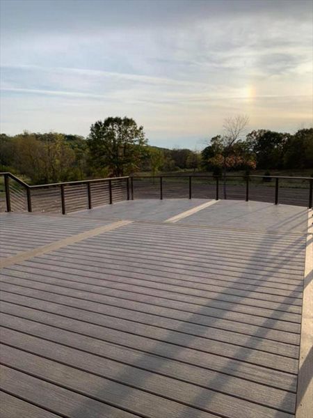 This deck features Trex enhance rocky harbor as main deck and Trex enhanced toasted sand as picture frame/middle divider.