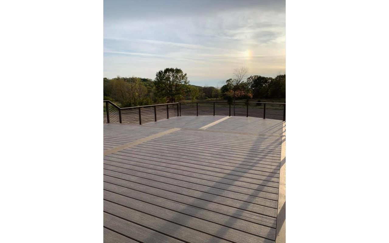 This deck features Trex enhance rocky harbor as main deck and Trex enhanced toasted sand as picture frame/middle divider.