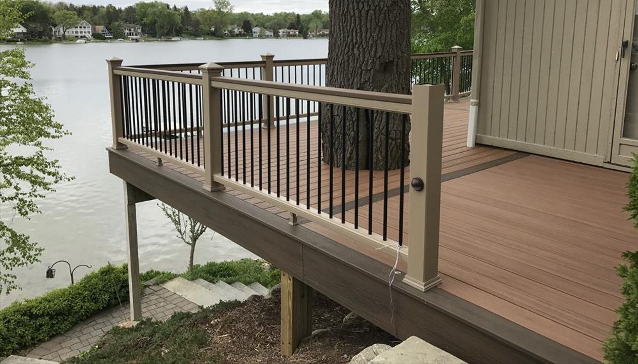 Check out this custom Trex deck Images built out of Tiki Torch / Spiced Rum decking accentuated by Rope Swing railing in West Bloomfield, MI.