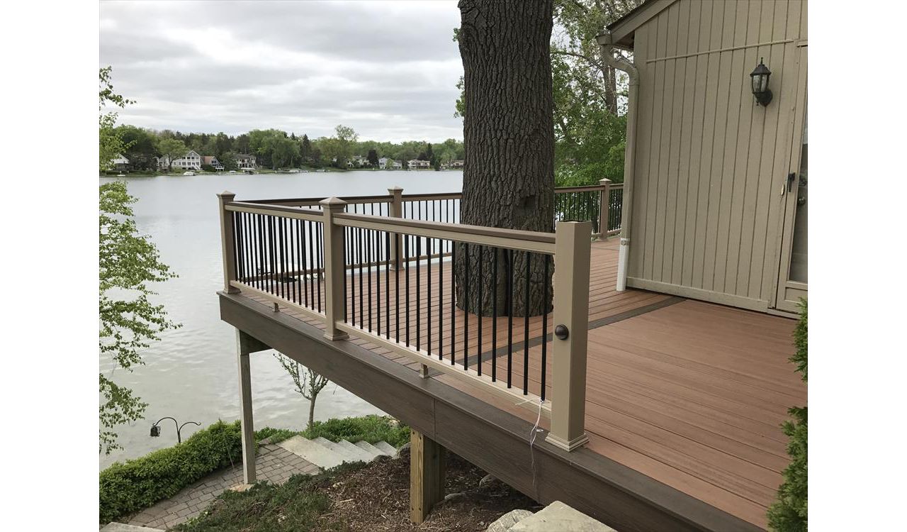 Check out this custom Trex deck Images built out of Tiki Torch / Spiced Rum decking accentuated by Rope Swing railing in West Bloomfield, MI.