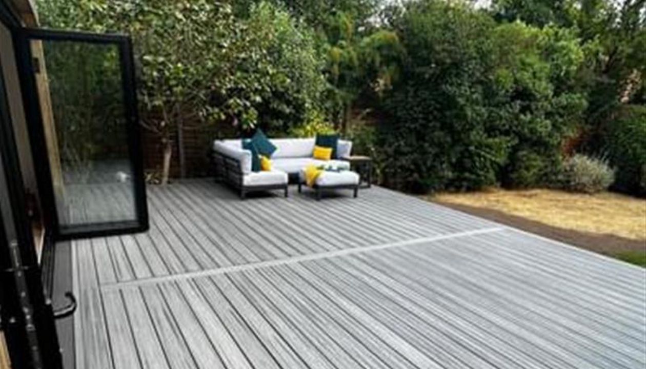 Trex transcend island mist decking, picture framed with a breaker board through the main field. Wheel chair access ramp with a full width steps with fascia lighting. Location Ipswich, Suffolk