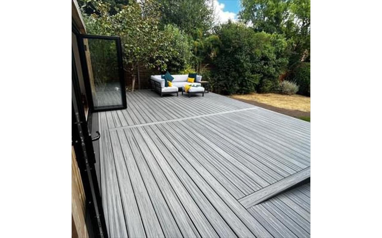 Trex transcend island mist decking, picture framed with a breaker board through the main field. Wheel chair access ramp with a full width steps with fascia lighting. Location Ipswich, Suffolk
