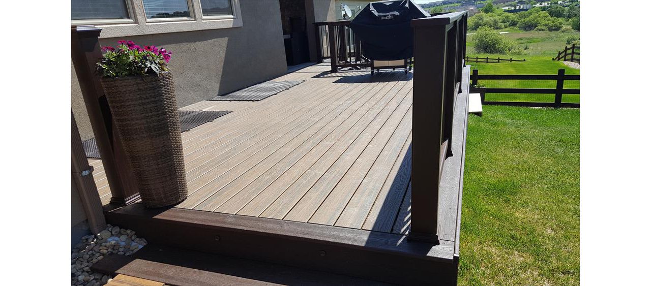Trex Transcends Tiki Torch decking, spiced rum fascia,drink rail, & vintage lantern composite rails