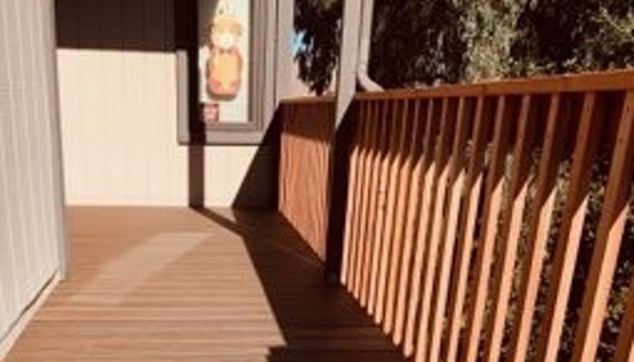 Trex Transcend Tropicals Spiced Rum with redwood railing