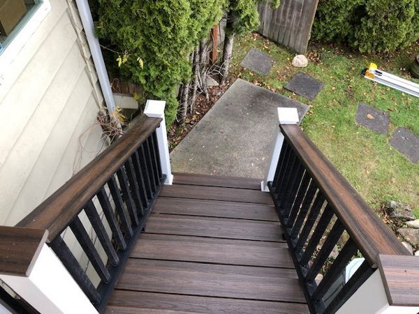 Trex Transcend Tiki Torch body w/ Spice rum boarder. Transcend railing w/ cocktail top cap and rain escape