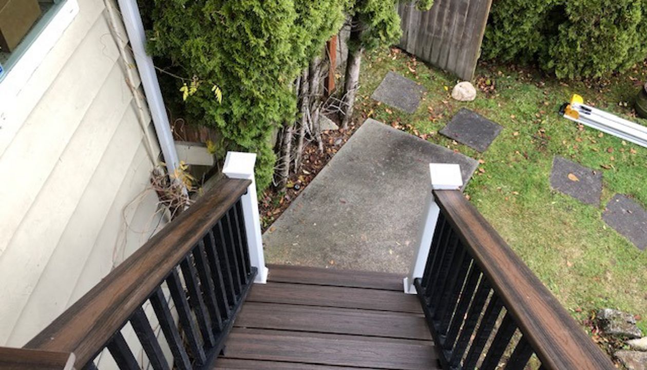 Trex Transcend Tiki Torch body w/ Spice rum boarder. Transcend railing w/ cocktail top cap and rain escape