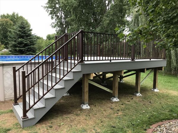 Trex pool deck in Select Pebble Gray decking with Trex Signature bronze aluminum railings by GE Contracting LLC in DePere, WI