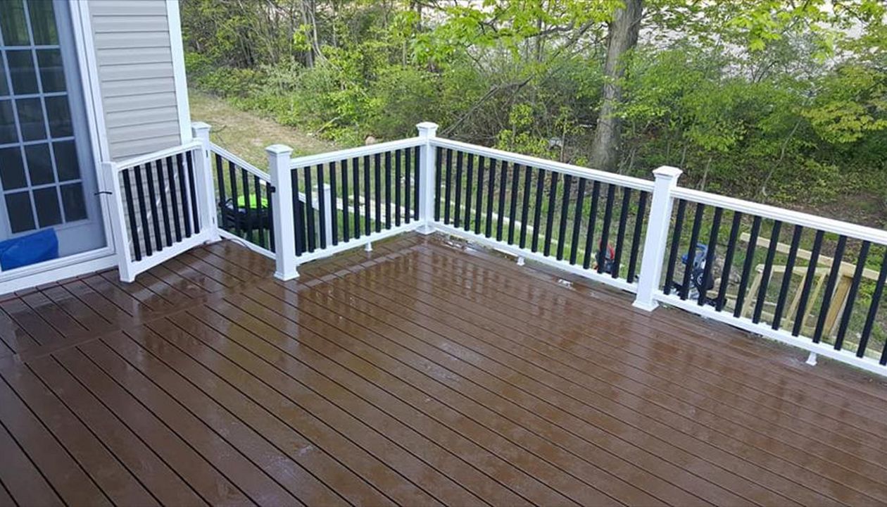 Transcend railing with black balusters and deck lighting