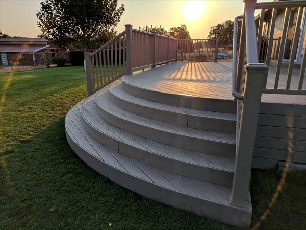 Custom Trex Rope Swing curved deck in Redding CA with Trex Transcend railing and multiple stairways. Majestic Builders is proud to provide top quality composite decks that will last a lifetime.