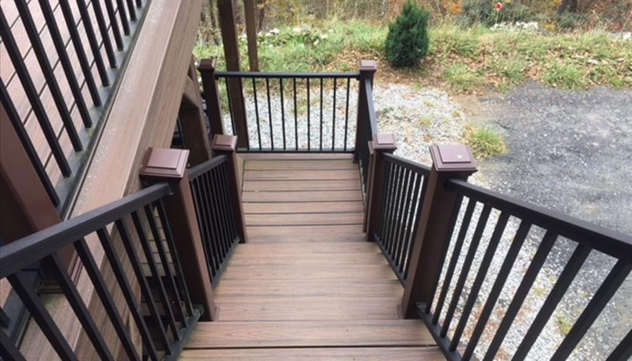 This beautiful set of Trex Transcend Spiced Rum stairs & Trex Signature rails are safe no matter the weather outside.