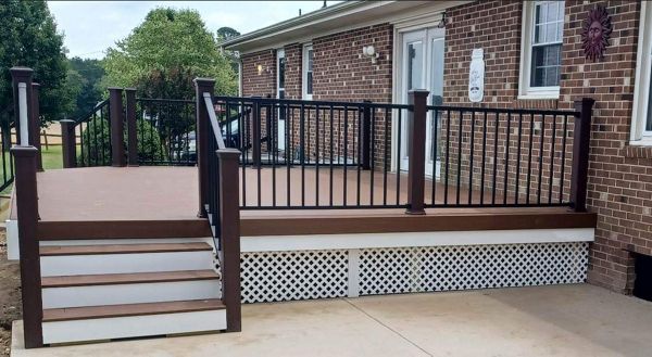 Trex Enhance Basics Saddle Deck with Signature Black Handrails works well with this brick home