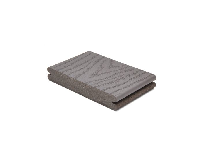 A single gray composite decking board is displayed against a plain white background. The board features a wood grain texture on its surface, highlighting its realistic appearance. The sample is shown at an angle, emphasizing its thickness and edge profile. No visible text, numbers, or logos are present in the image.