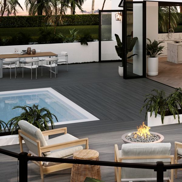 sig-miami-005-wy-sig-glass-railing-pool-chairs-table-house.jpg