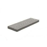 A single gray composite deck board is displayed against a white background. The board features a realistic wood grain pattern on its surface, highlighting its textured finish. The image is well-lit, showcasing the clean edges and uniform color of the material. No visible text, numbers, or branding appear on the board.