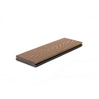 A single brown composite decking board is displayed against a white background. The board features a realistic wood grain pattern on its surface, highlighting its natural appearance. The edges show a tongue-and-groove profile, suitable for easy installation. The image focuses on the product itself, with no visible text or numbers present.