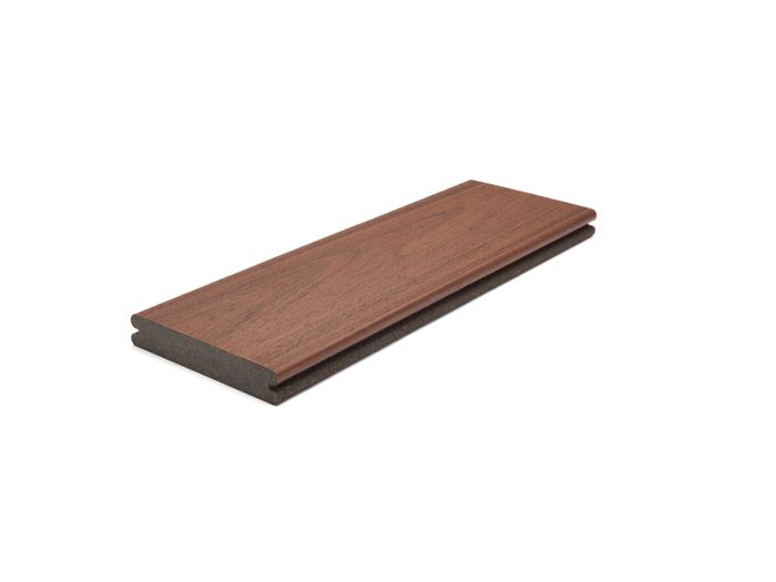 A single rectangular composite decking board is displayed against a clean white background. The board features a woodgrain texture and a rich brown color, with visible grooves along the edge for installation. The image is well-lit, highlighting the material's surface and construction details. No visible text, numbers, or logos are present.