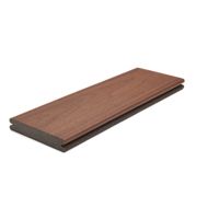 A single rectangular composite decking board is displayed against a clean white background. The board features a woodgrain texture and a rich brown color, with visible grooves along the edge for installation. The image is well-lit, highlighting the material's surface and construction details. No visible text, numbers, or logos are present.