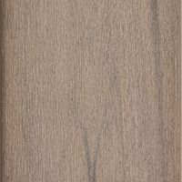 A close-up view of a wooden surface showcasing its natural grain and texture. The image highlights the intricate patterns and subtle color variations in the wood. The setting appears neutral and minimalistic, emphasizing the organic material. No visible text, logos, or numeric values are present.