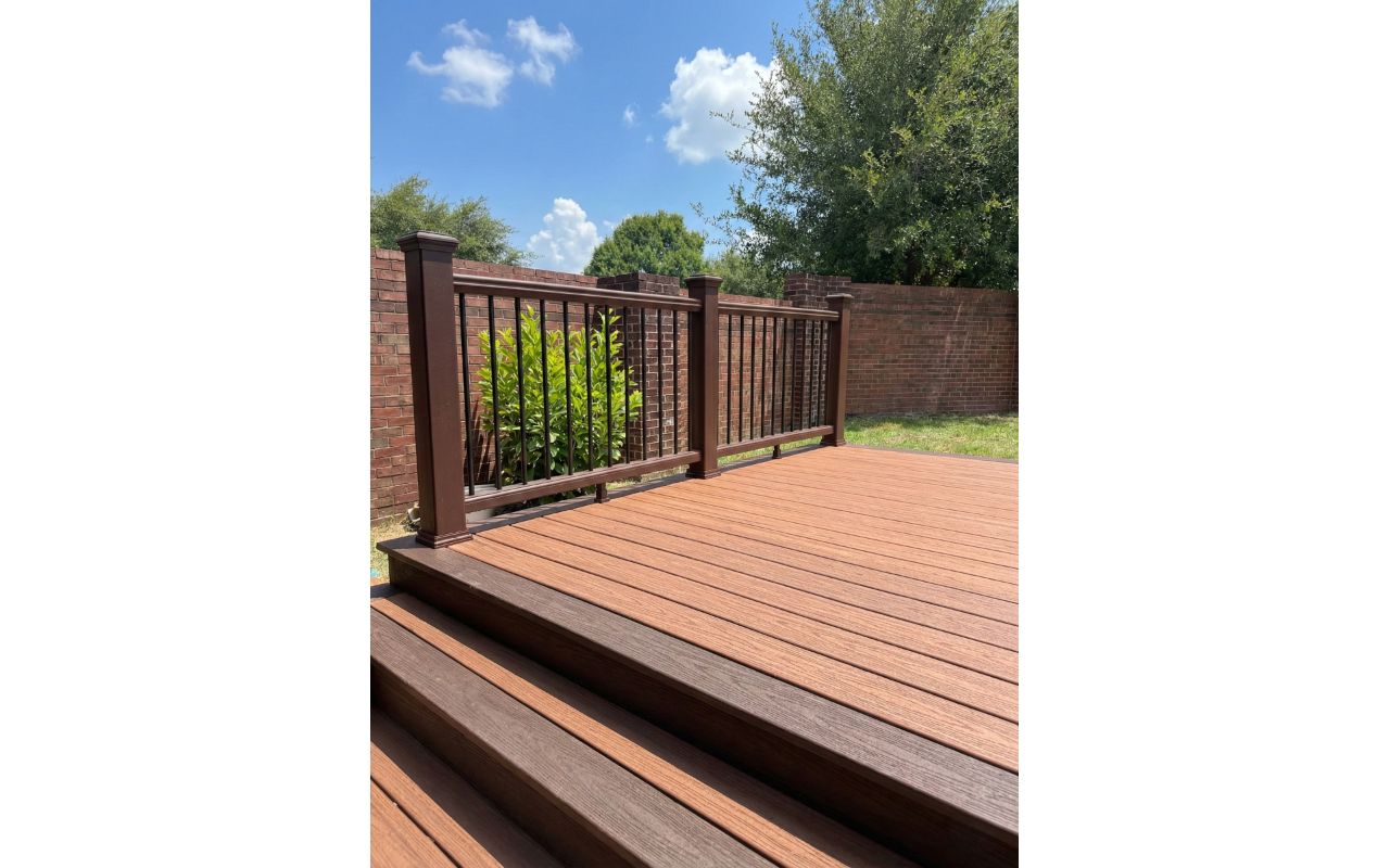 Trex composite deck with premium railing system in Houston, TX. Elevated design with wide steps for seamless indoor-outdoor transition.