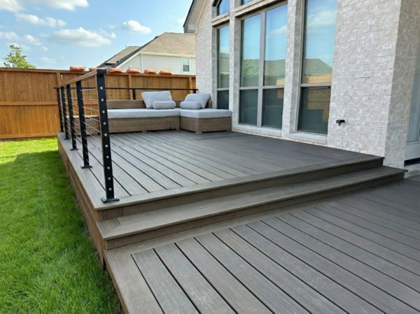 Multi-level Trex composite deck with integrated framing design. Built for both aesthetics and structural performance.