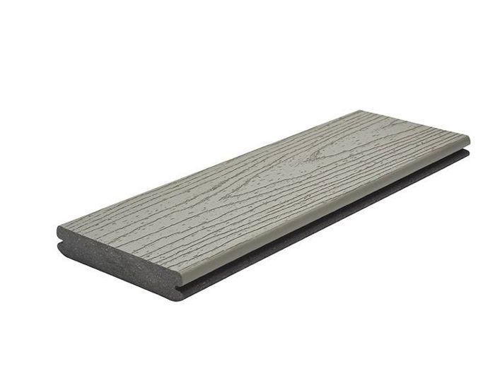A single gray composite deck board is shown against a white background. The board features a realistic wood grain texture on its surface, mimicking the appearance of natural wood. Its edges are grooved, suggesting compatibility with hidden fastener systems. The image highlights the board's clean lines and modern finish. No visible text or numbers are present.