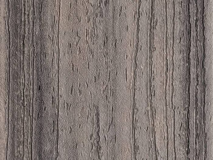This image shows a close-up view of a textured wooden surface featuring vertical grain lines and natural imperfections. The wood appears weathered, with a brown and gray color palette that highlights its organic texture. No visible text, numbers, or logos are present. The overall mood is rustic and natural, suitable for backgrounds or design elements.