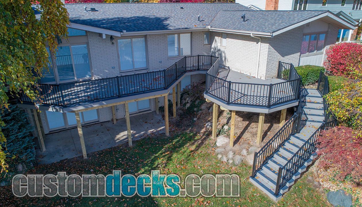 Trex Select Pebble Grey decking and fascia with Winchester Grey border and Black Signature Railing