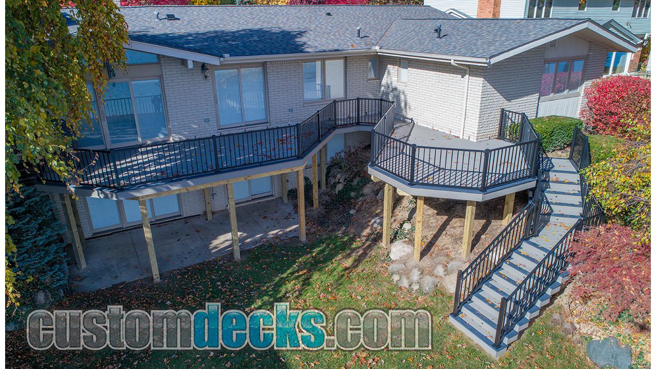 Trex Select Pebble Grey decking and fascia with Winchester Grey border and Black Signature Railing