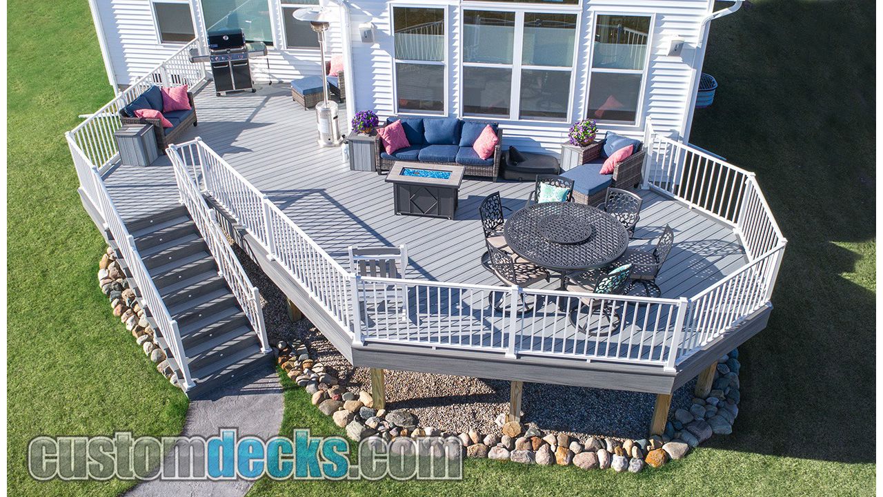 Enhance Foggy Wharf decking with Island Mist border and White Signature aluminum railing